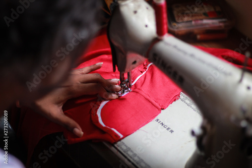 woman working on sewing machine