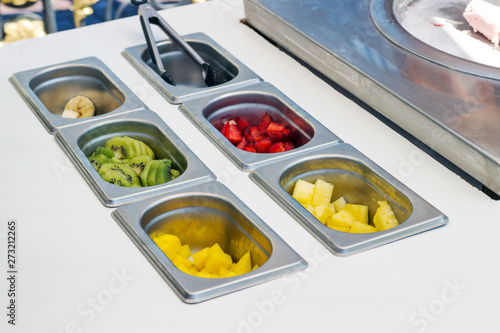 trays with sliced ​​fruit for making Thai ice cream