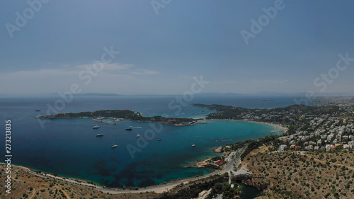 Aerial view of iconic emerald sandy celebrity beach of Asteras or Astir, Vouliagmeni, Athens riviera, Attica, Greece © aerial-drone