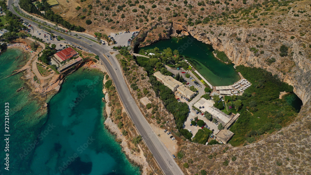 Aerial drone, bird's eye photo from iconic lake Vouliagmeni famous for healing abilities, Athens riviera, Attica, Greece
