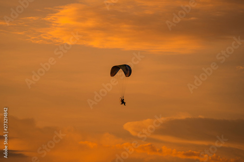 The silhouette of the paramotor at sunset