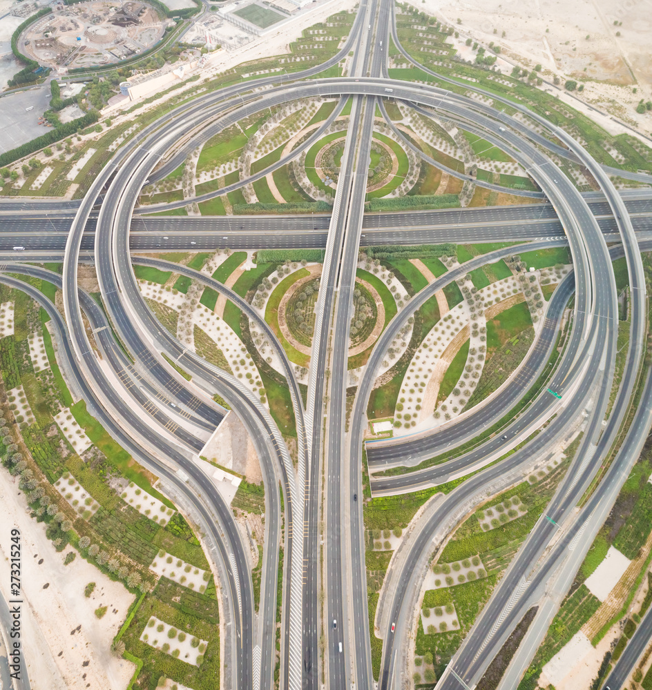 Aerial view of geometrical traffic lanes in Dubai, U.A.E. Aerial view of geometrical traffic lanes in Dubai, U.A.E.