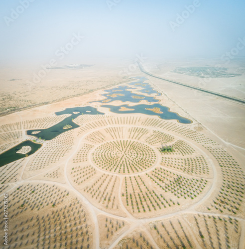 Aerial view of Al Qudra lakes in the middle of Saih Al Salam Desert in Dubai, UAE. photo