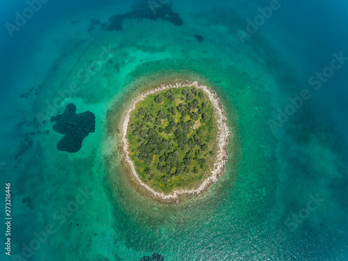 Aerial view of small islet of Itea called Agios Athanasios in Greece photo