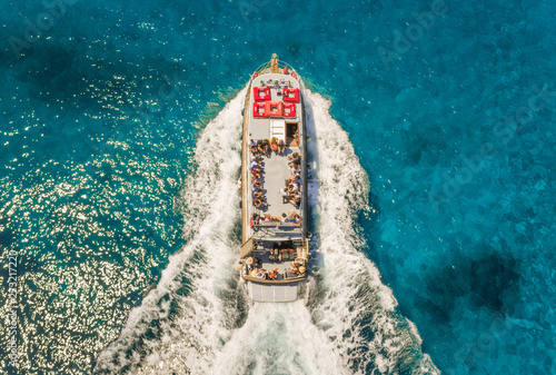 Aerial view of excursion boat in the mediterranean sea, Kosta, Greece.
