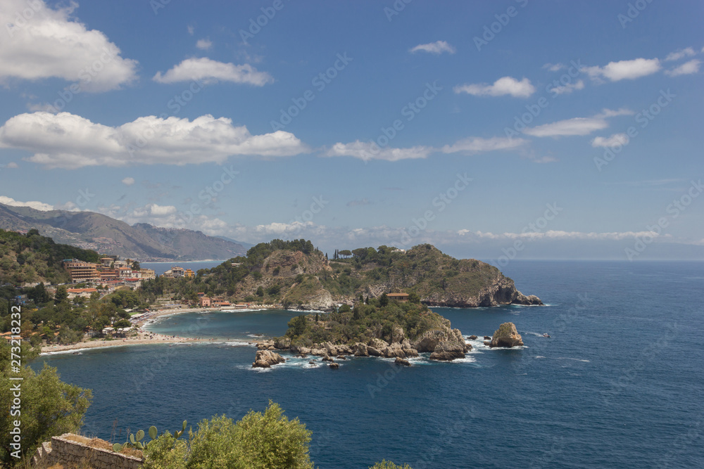 Taormina Sicily panorama of famous Isola Bella, scenic coastline and blue seascape
