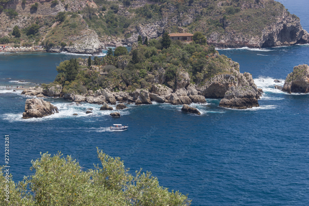 Taormina Sicily spectacular beach at Isola Bella, close up view with rocky coast, blue sea and nature 
