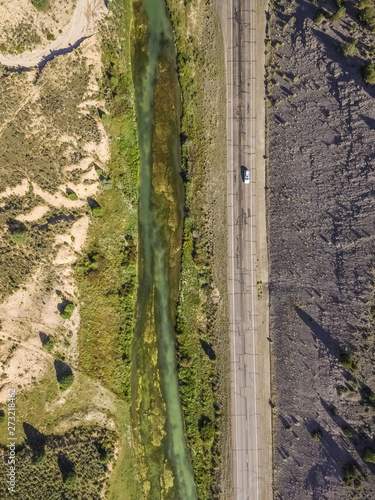 Aerial view of sevier blue river following the road in Hatch, Utah, USA. photo