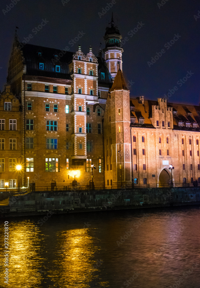 Gdansk, Poland - February 07, 2019: View of Gdansk's Main Town from the Motlawa River at night. Gdansk, Poland