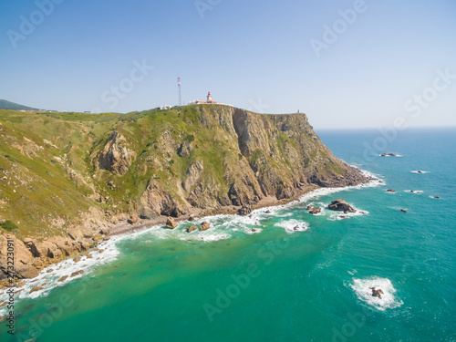 Sea view of lighthouse at Cabo da Roca cape, westernmost extent of mainland Portugal and continental Europe.