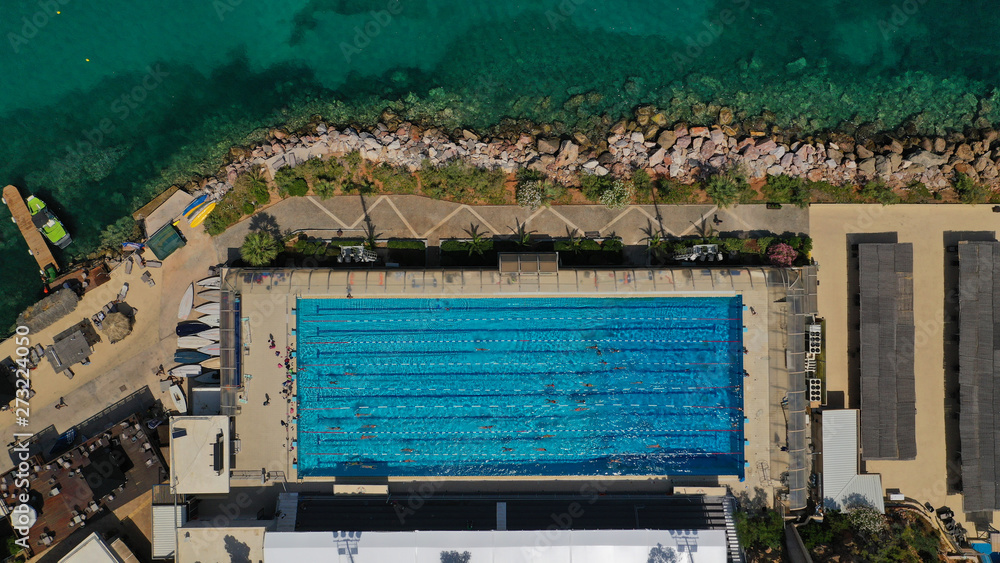 Aerial top view photo of luxury tropical resort with large pool located in mediterranean destination