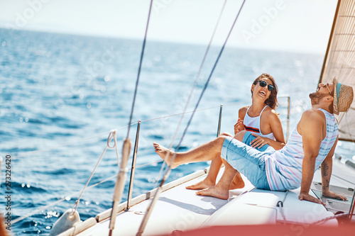 Smiling lovers relaxing on a luxury yacht. couple on cruise..