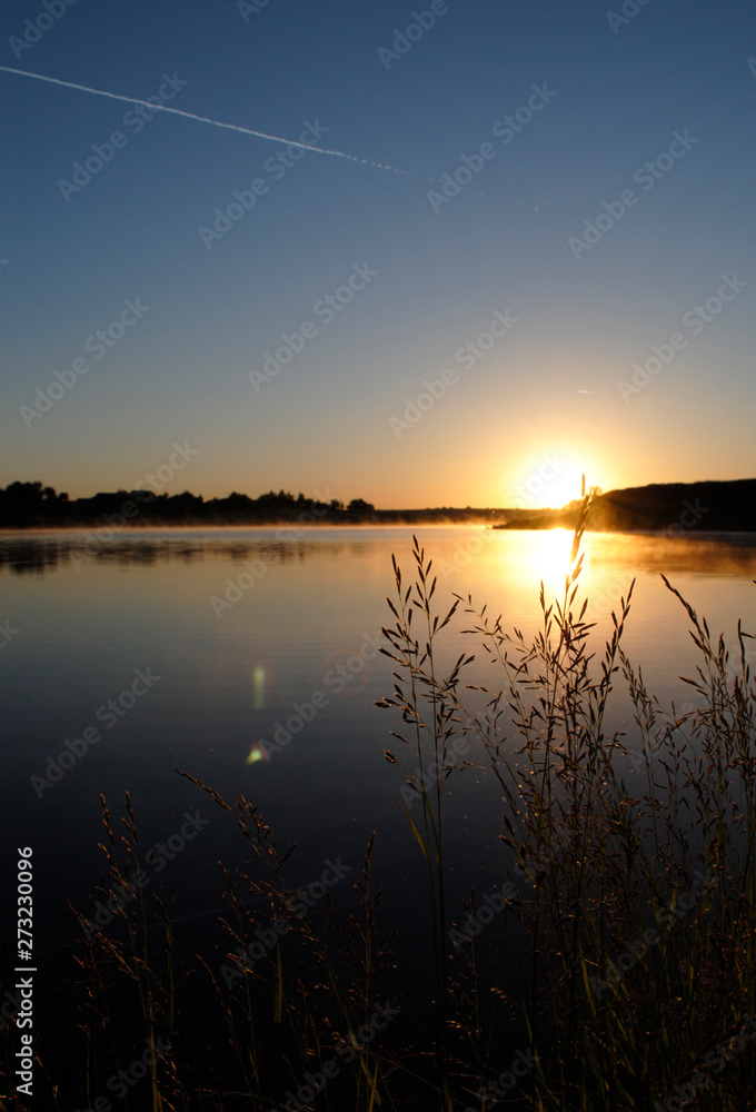 sunset beautiful summer landscape with cloudy sky and natural lake