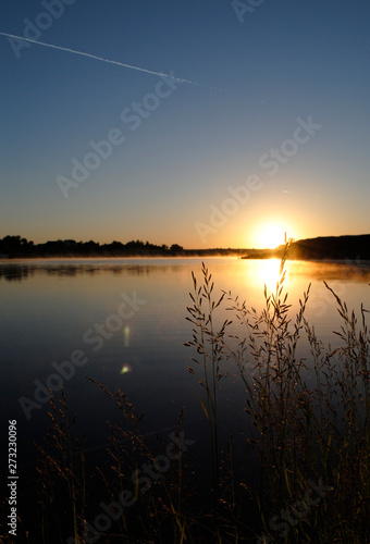 sunset beautiful summer landscape with cloudy sky and natural lake