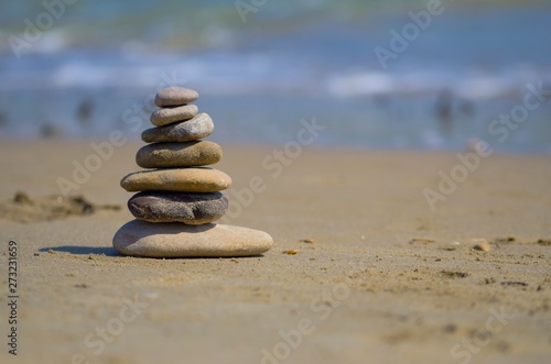 Zen stones balanced on the beach