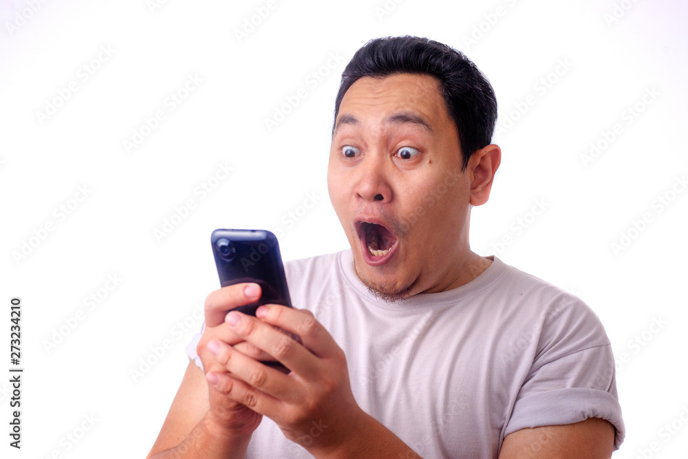 Shocked Happy Man Looking at Smart Phone Shocked Happy Man Looking at Smart Phone