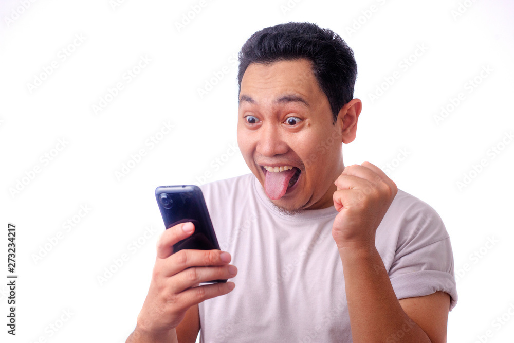 Shocked Happy Man Looking at Smart Phone Shocked Happy Man Looking at Smart Phone