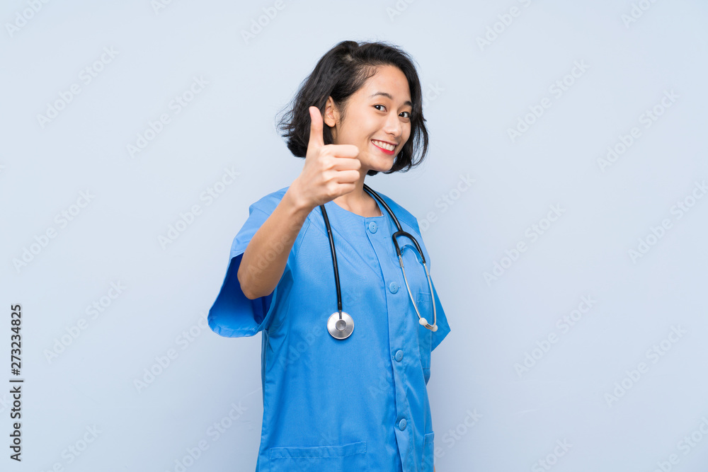 Surgeon doctor woman with thumbs up because something good has happened Surgeon doctor woman with thumbs up because something good has happened