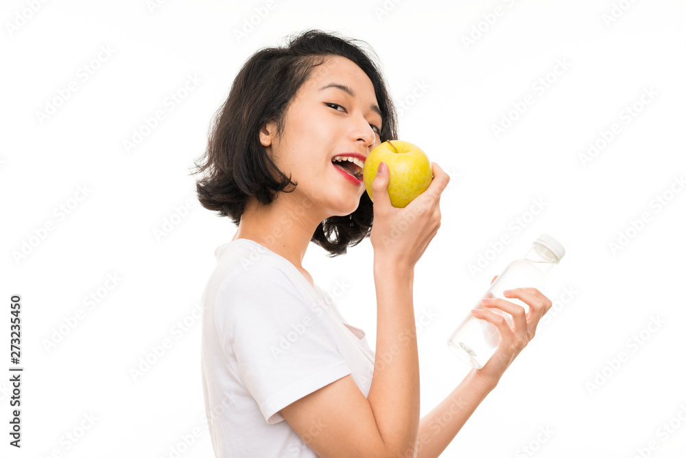 Asian young woman with an apple and bottle of water Asian young woman with an apple and bottle of water