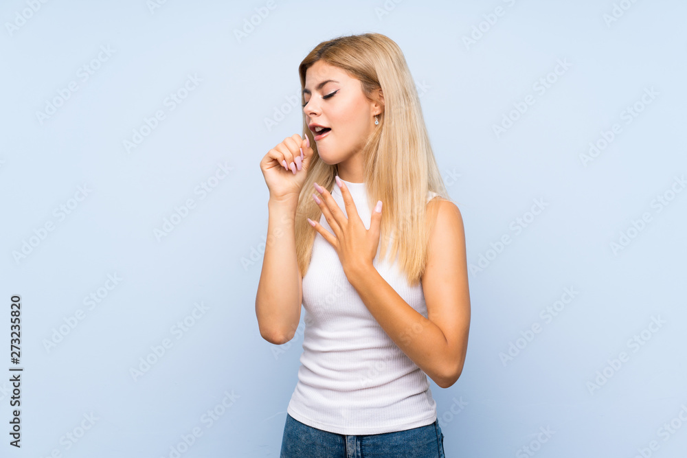 Teenager girl over isolated blue background making stop gesture and disappointed Teenager girl over isolated blue background making stop gesture and disappointed