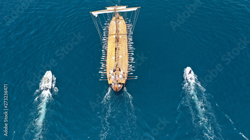 Aerial view of Athenian Trireme "OLYMPIAS", a replica of ancient warship of 5th BC century, cruising to port of Faliro, Athens Riviera, Attica, Greece