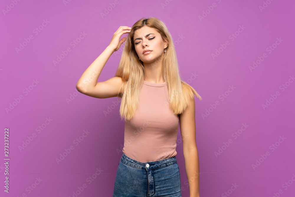 Teenager girl over isolated purple background having doubts while scratching head Teenager girl over isolated purple background having doubts while scratching head