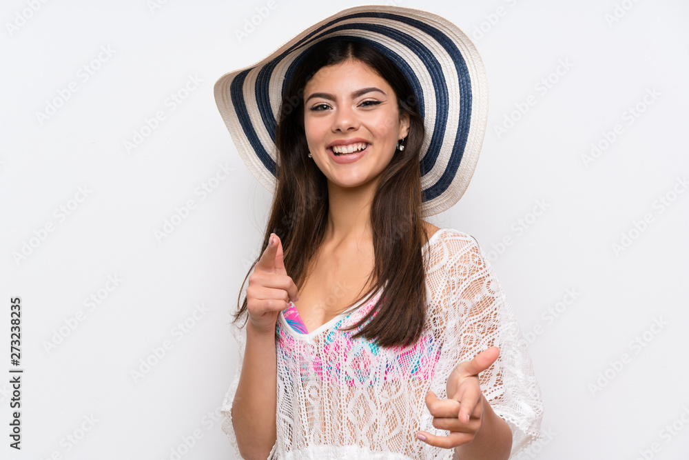 Teenager girl on summer vacation points finger at you Teenager girl on summer vacation points finger at you