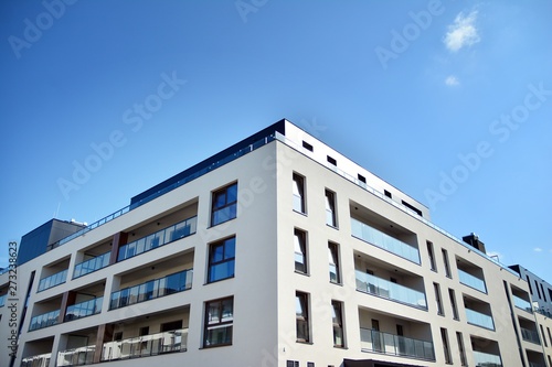 Multistory new modern apartment building. Stylish living block of flats.