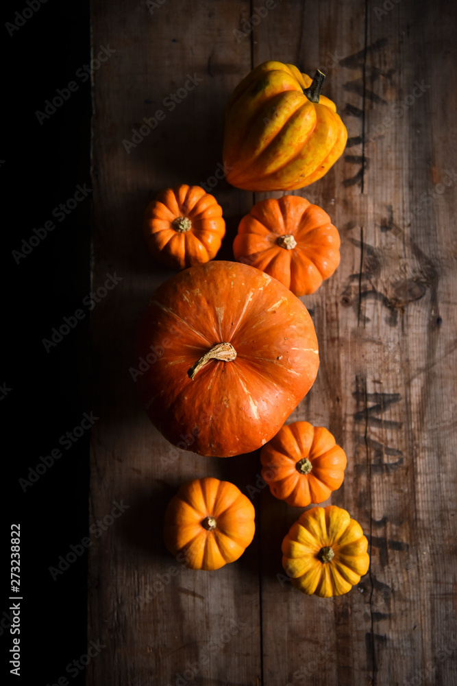 Orange pumpkins on a wooden crate Orange pumpkins on a wooden crate
