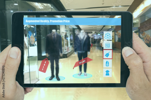 smart retail with augmented mixed virtural reality marketing technology concept, man hand hold tablet to see new product which special price, sale, percent off and can bur or contact with call center