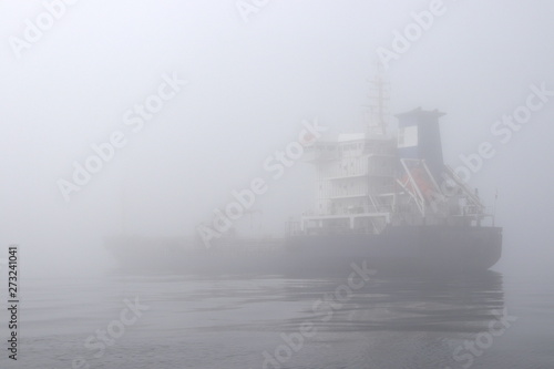 Tanker ship in the dense fog.