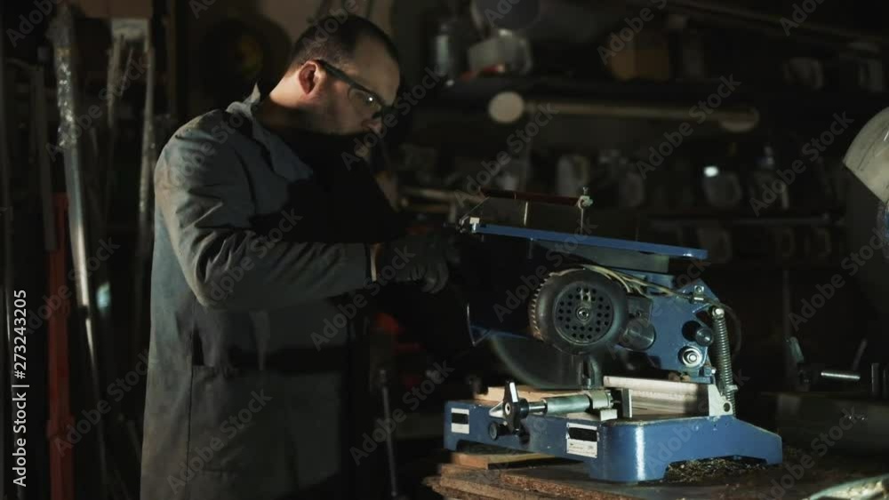 Man Works With Electric Tool. Sawing Wood. Man Works With Electric Tool. Sawing Wood.