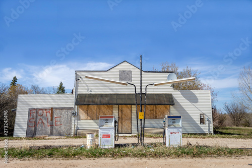 old boarded up gas station for sale.