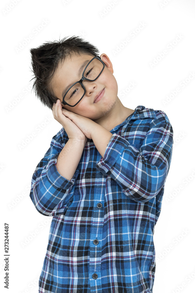 Little kid in glasses feels sleepy on isolated white background with blue shirt Little kid in glasses feels sleepy on isolated white background with blue shirt