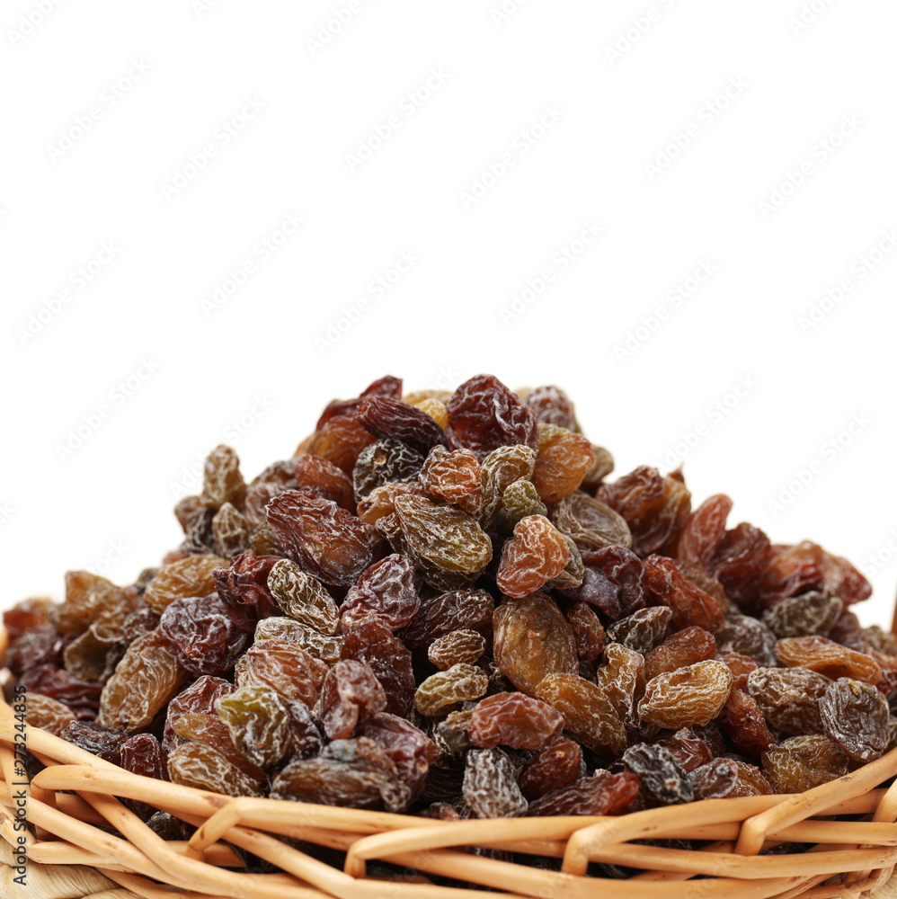 brown raisin stacked together on white background