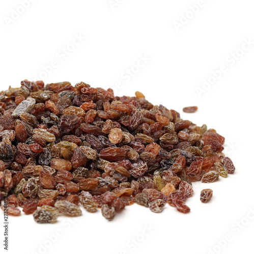 brown raisin stacked together on white background