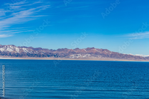 The frozen Sailimu lake with snow mountain background at Yili  Xinjiang of China