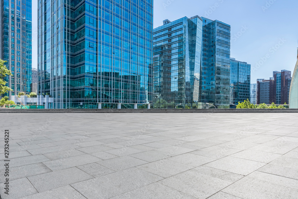 Panoramic skyline and modern business office buildings with empty road,empty concrete square floor