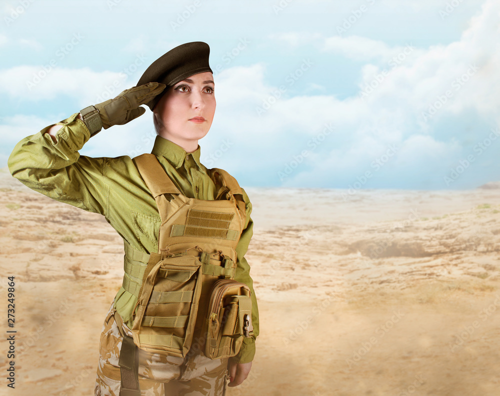 Young beautiful military soldier woman in protective armor tactical