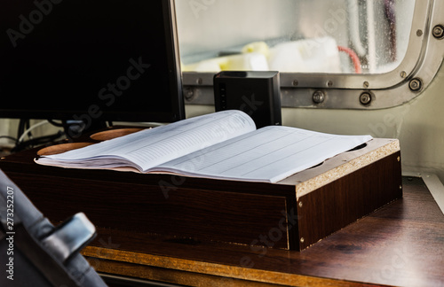 Ship logbook on the table.