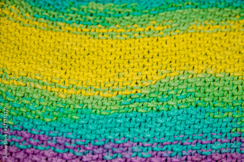 multicolor yellow, green, orange and purple horizontal knitted pattern background © kapichka