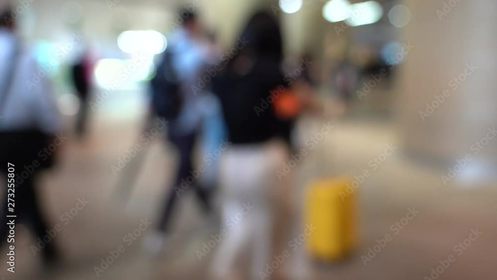 Blurred People walking in shopping mall; slow motion Blurred People walking in shopping mall; slow motion