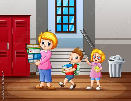 A children help the teacher carry a book