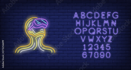 Guy wearing VR headset neon sign. Man experiencing virtual reality on brick wall background. Vector illustration in neon style for billboards, flyers, vr games