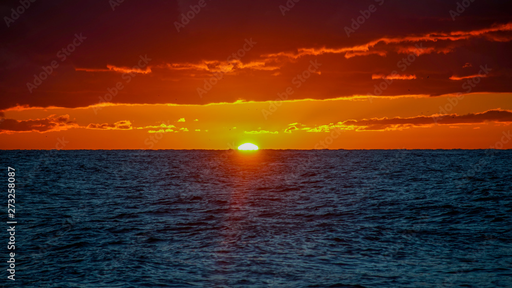Dramatic fiery sunset over the sea landscape. Dramatic fiery sunset over the sea landscape.