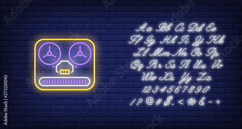 Reel-to-reel tape recorder neon sign. Music and vintage audio equipment design. Night bright neon sign, colorful billboard, light banner. Vector illustration in neon style.