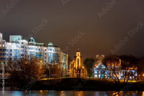 Island of Courage and Sorrow or Ostrov Slyoz on Svisloch river bank at night. Minsk. Belarus
