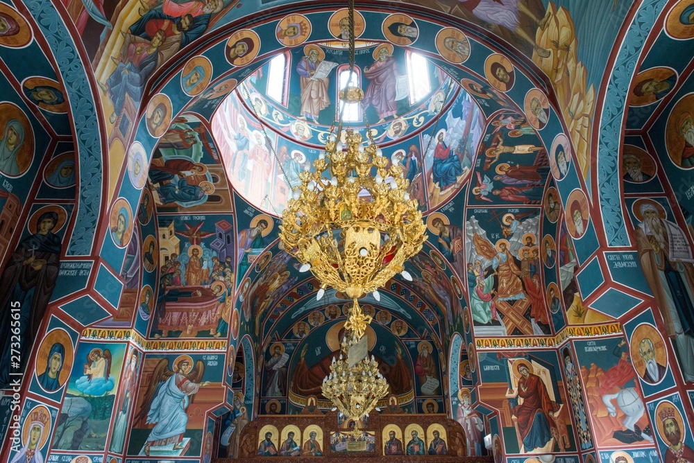 orthodox church interior with golden chandelier