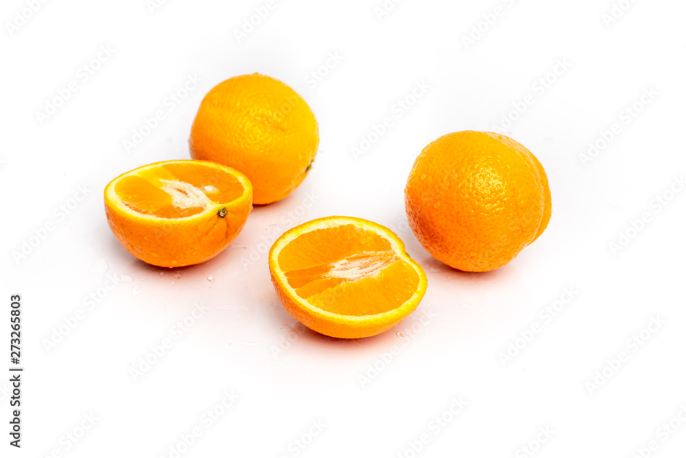 isolated on a white sprinkled water background, fresh, juicy orange fruits isolated on a white sprinkled water background, fresh, juicy orange fruits