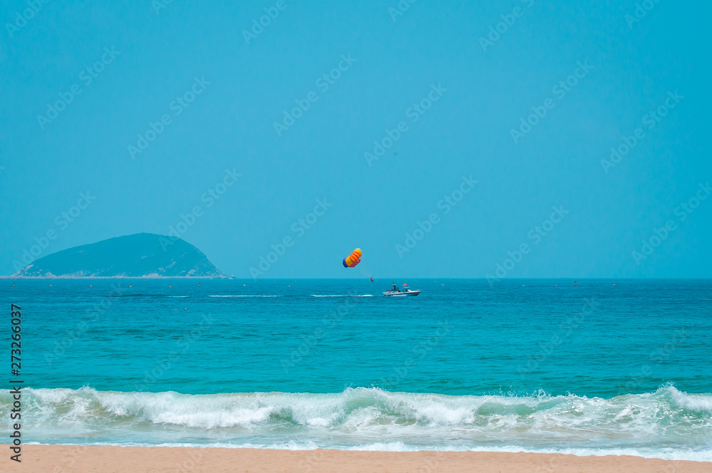 Parasailing, parascending, parakiting - is a this fascinating active form of recreation. where a person is towed by a boat and he flies with a parachute over the water. Parasailing, parascending, parakiting - is a this fascinating active form of recreation. where a person is towed by a boat and he flies with a parachute over the water.